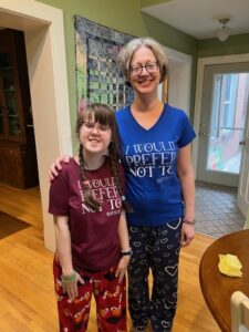 Sarah and Jenny in t-shirts that read "I would prefer not to"